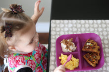 Load image into Gallery viewer, Girl eating breakfast on Kiddiebites Plum Silicone Plate