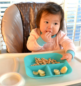 Baby in high chair with Kiddiebites Teal Silicone Plate